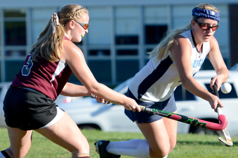 Oceanside’s Krissy McNichol, right, and Nokomis’ Rosalie Bowman battle for a loose ball during Thursday’s game at Rockland. Nokomis won 2-1 in overtime. (Photo by Ron Hawkes)