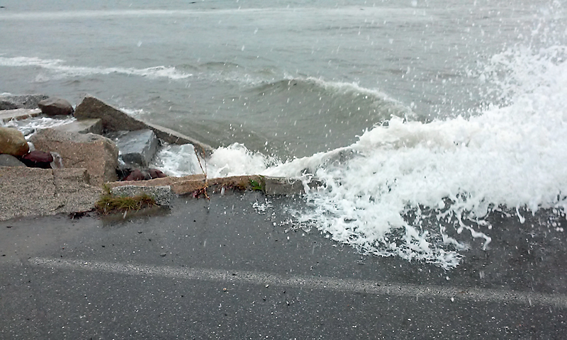 Wind-whipped waves at high tide breach Route 1 at Lincolnville Beach Thursday at the 12:40 p.m. high tide. (Courtesy Nanette Gionfriddo)