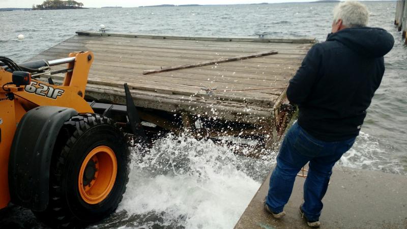 Ahead of the stormy weather Wednesday, Camden Harbormaster Steve Pixley works with other town employees to remove the last of the town’s floats from Steamboat Landing. (Courtesy Steve Pixley)
