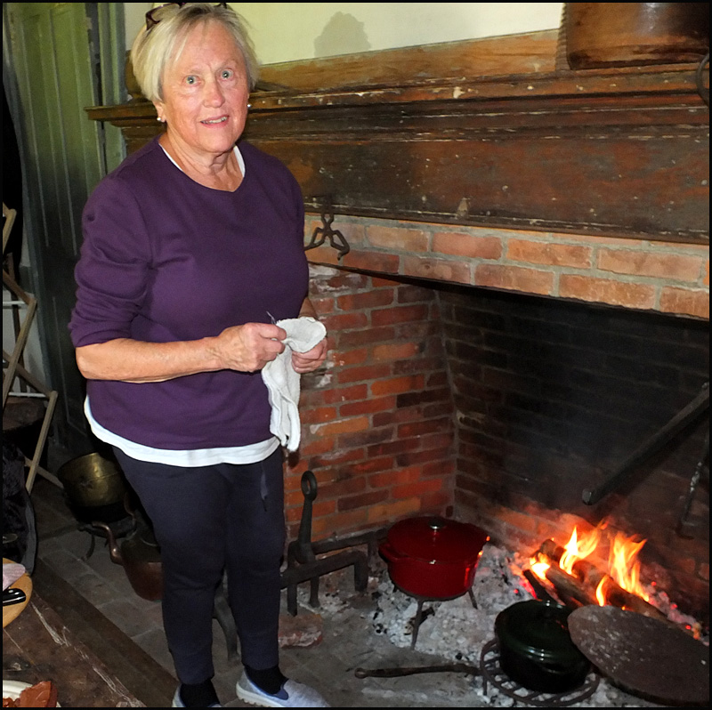 Jane Carr was cooking chicken and apples in the fireplace of the Conway House.