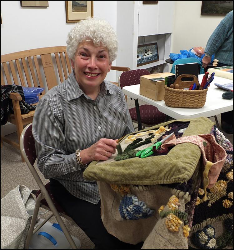 Gabrielle Wicklow was demonstrating traditional rug-hooking, which started in the Canadian Maritimes around 250 years ago. “It was originally a craft of need. Women would use old burlap feed bags and tear up old clothing, cutting it into strips, color it and hook it into rugs. They needed to cover their floors. It’s a simple technique of pulling loops to the surface.”