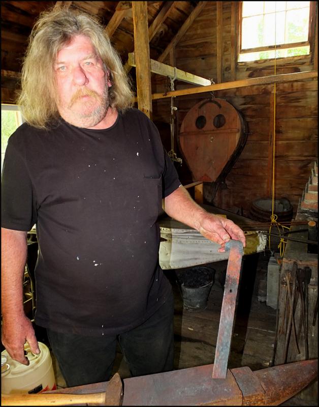 Blacksmith Martin Stanley shows his progress on making a froe.
