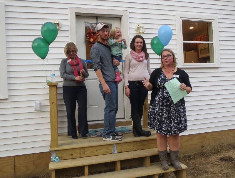 The family is joined by Mandie Sawyer. (photo by Erica Thoms)