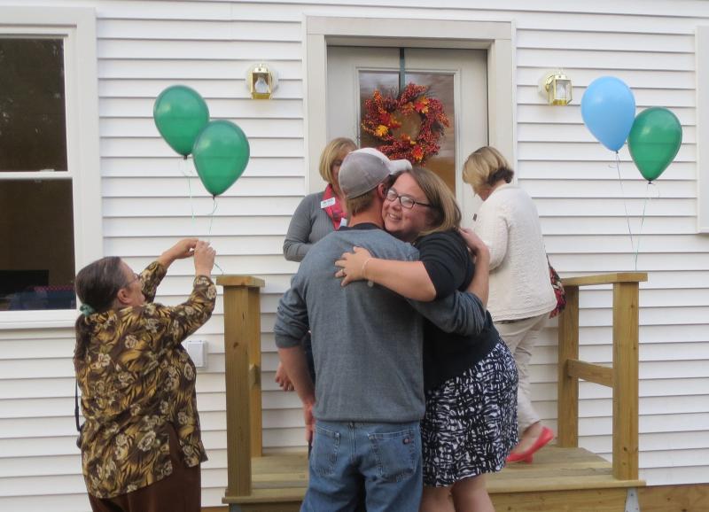 Mandie Sawyer offers Thibodeau a congratulatory hug. (photo by Erica Thoms)