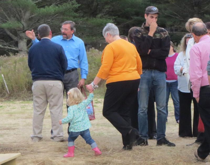 Bilzier and Thibodeau’s daughter walk to the back door of the residence with family. (photo by Erica Thoms)