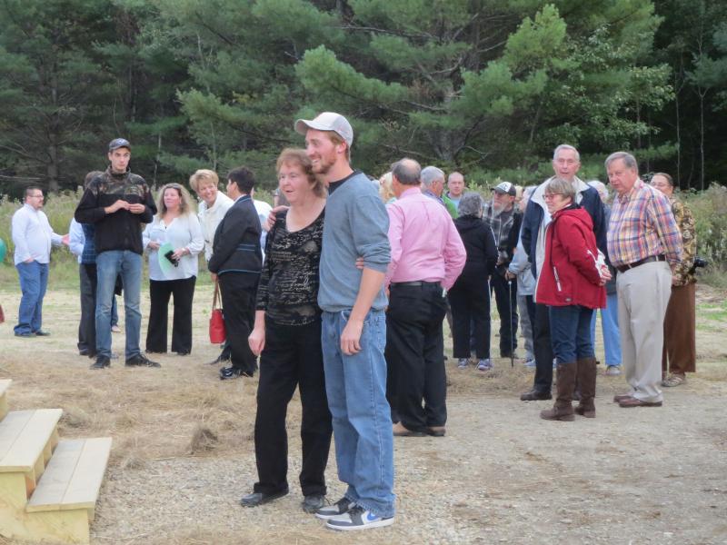 Thibodeau poses with the previous owner of the property, in front of the crowd gathered for the ribbon cutting ceremony. (photo by Erica Thoms)