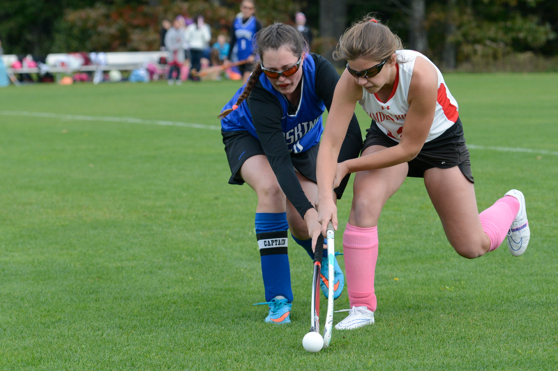 Camden Hills Hilary Merrifield battles with an Erskine player for control of the ball. (Photo by Ron Hawkes)