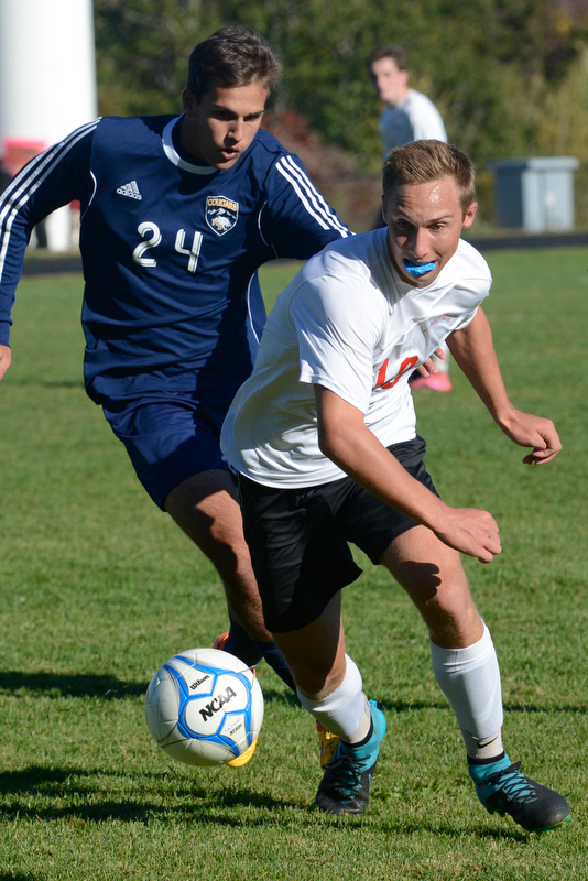 Camden’s Josaih Krul wins the battle for the 50-50 ball. (Photo by Ron Hawkes)