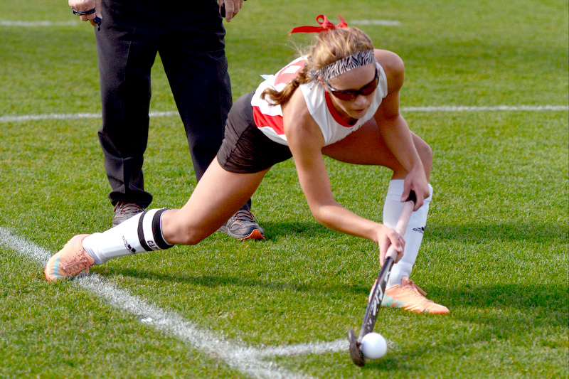 Camden Hills Emily Daggett delivers the ball on a penalty corner against No. 9 John Bapst. The Windjammers won 4-0 and advance to the quarterfinals. (Photo by Ron Hawkes)