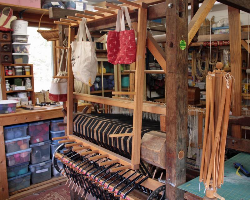 The O’Brien’s early 19th century wooden loom just keeps weaving along, albeit with a few metal pieces added to the joints to keep it plumb and tight.