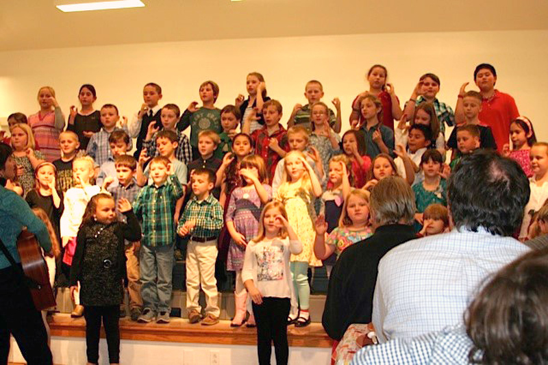 Students in first- through fourth-grades sing ;The ABCs of Cushing’ during the Cushing Community School’s annual Harvest Fest (Courtesy Carla Myrick)