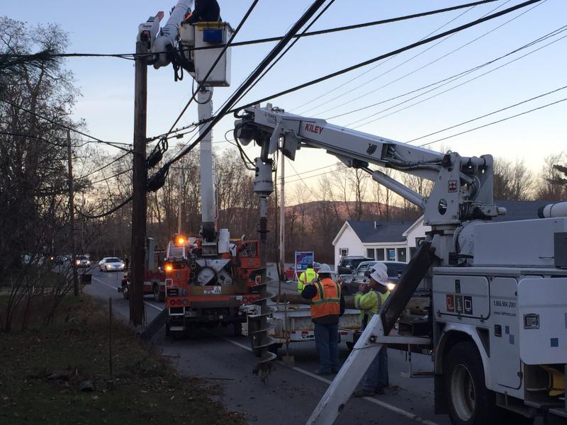 Central Maine Power, Fairpoint Communications, and Time Warner Cable work on repairing the fallen wires. Photo by Rockport Fire Department.