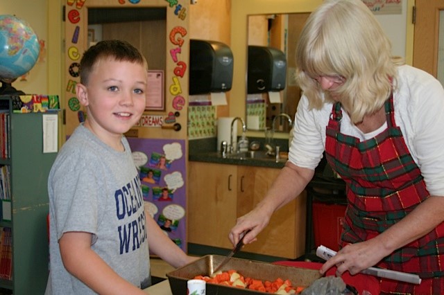 Fourth-grade cooking with Benjamin Tripp and teacher Mrs. Bernard. (Courtesy Carla Myrick)