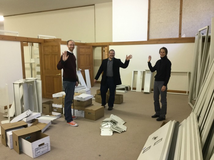 Waving from the children’s room of the new temporary library, L to R are, Ben Odgren, Ben Blackmon and Kim Slocomb. (Photo Courtesy of Amy Filley)