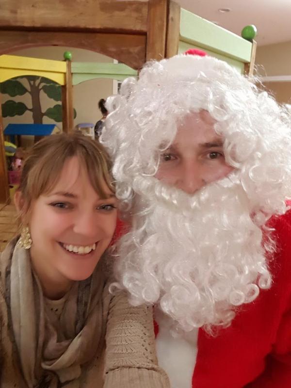 Heather taking a selfie with Santa.