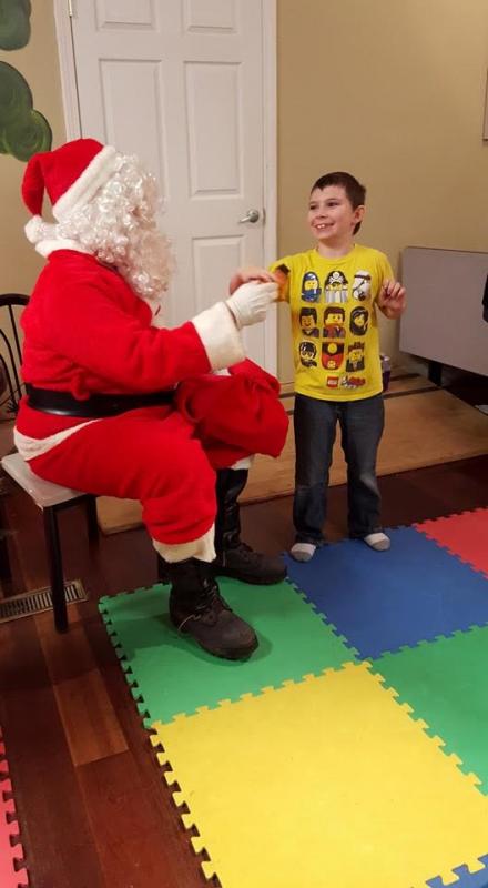 This is Tegan Carlson- he was telling Santa that he wants Thomas the Train.