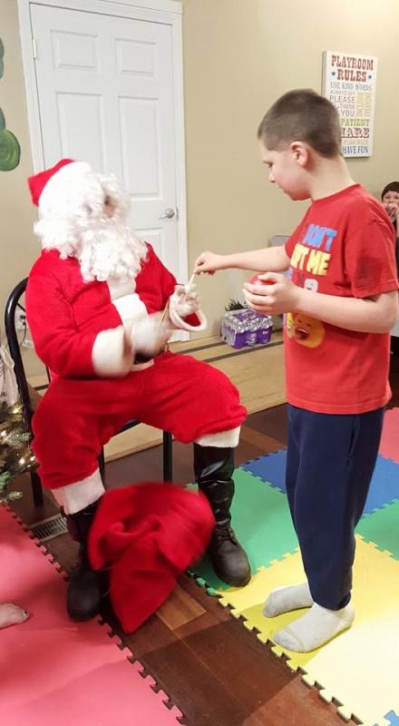 Isaac Richardson, was very interested in Santa, but would only do really quick “drive-bys”.