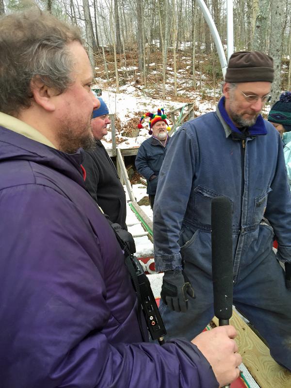 MPBN reporter Jay Field asks a few questions before his turn down the chute, his first time ever. (Photo by Holly S. Edwards)