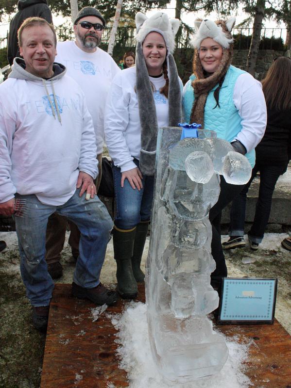 Team Adventure Advertising and their ice creation: A jester hat-wearing adult and child on a toboggan. (Photo by Holly S. Edwards)