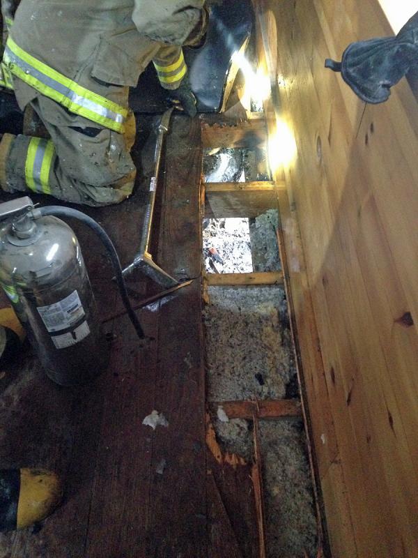 Embers fell between the floorboards, and landed on this blown-in insulation, causing a smoldering fire. (Photo courtesy Lincolnville Fire Department)