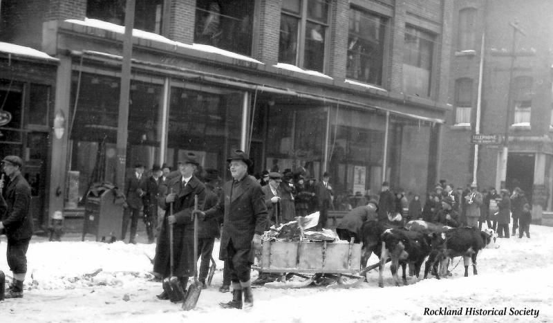 A small band (drum and trumpet) playing on the corner of Main & School Streets. The building is the Pillsbury Block where the Island Institute is today. (Photo courtesy Rockland Historical Society)