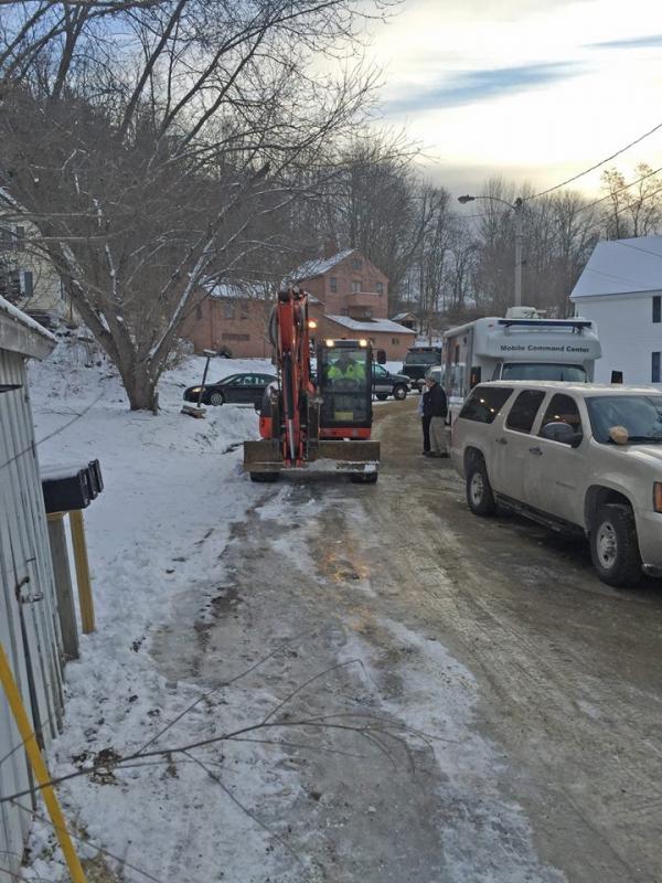Rockport Firefighter Mike Robertson, who also owns Rockport business Rhino Construction, switched from his fire gear to his excavator to help come sift through the remains of the building. (Photo courtesy of Justin Ford)