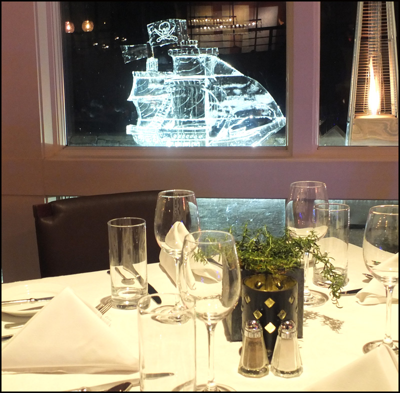 A view of an ice carving through the restaurant window.