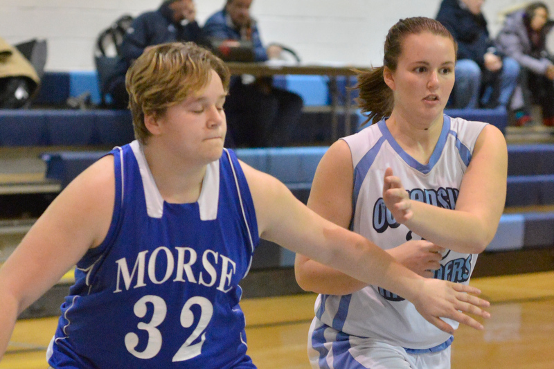 Oceanside’s Sara Door works around a Morse player for the rebound. (Photo by Ron Hawkes)