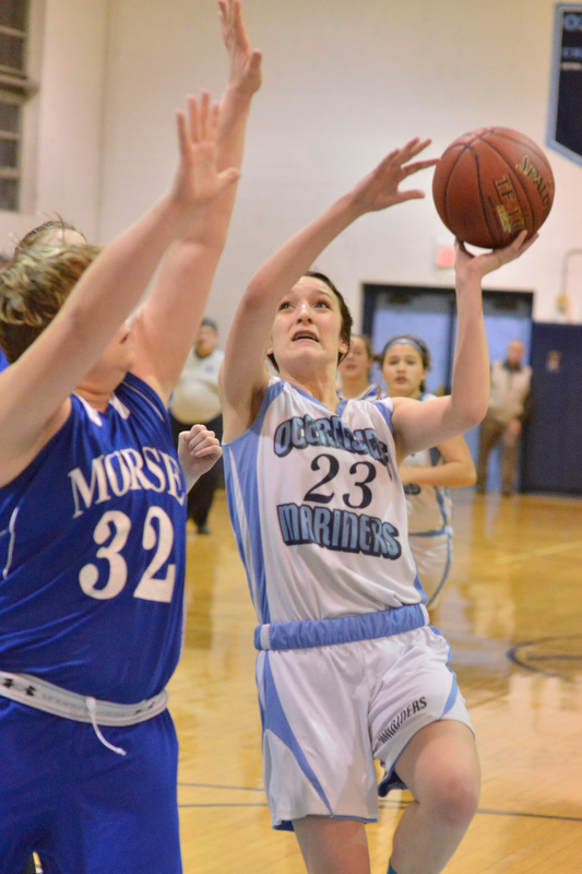 Oceanside’s Amelia Campbell drives to the basket for a layup. (Photo by Ron Hawkes)