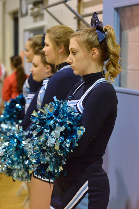 Oceanside cheerleader Rachel Philbrook waits for teh game to get started. (Photo by Ron Hawkes)