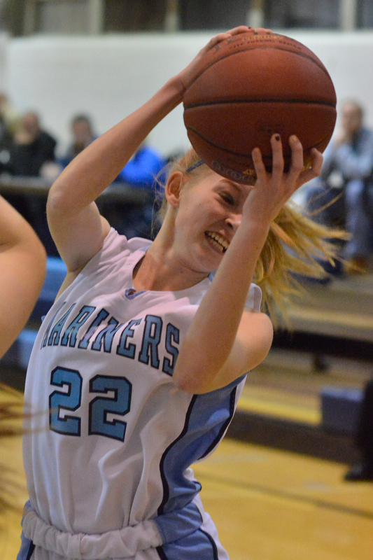 Oceanside’s Jillian Brooks pulls down a rebound during the first half. (Photo by Ron Hawkes)
