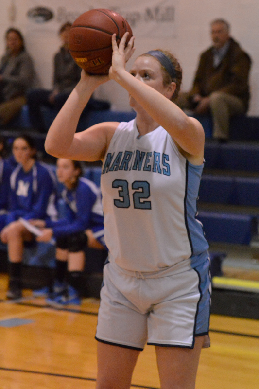 Oceanside’s Alexis Mazurek scores her two points before getting injured and leaving the game. (Photo by Ron Hawkes)