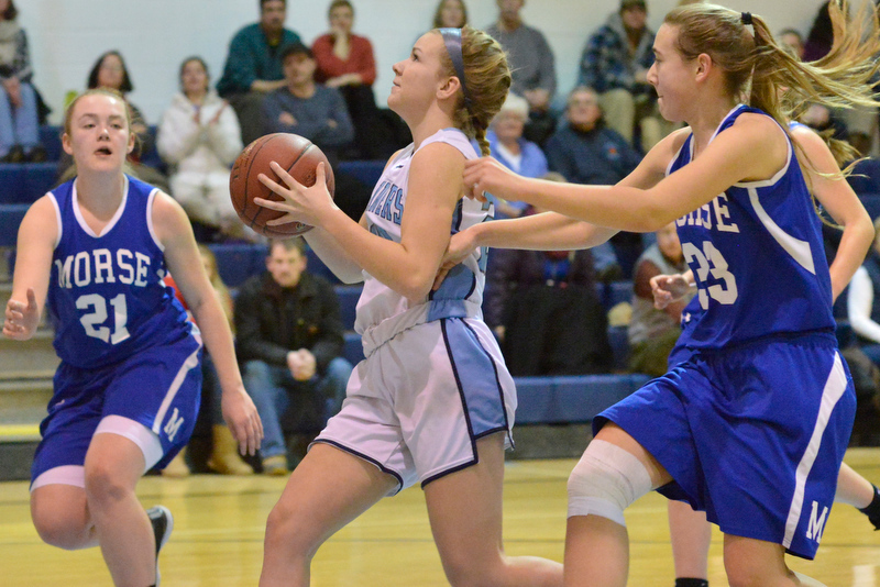Oceanside’s Haley Montgomery races to the basket with Morse’s Noa Sreden on her heels. (Photo by Ron Hawkes)