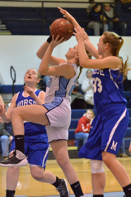 Morse’s Noa Sreden makes a beautiful block on the shot, but was called for the foul despite the perfect blocked shot. (Photo by Ron Hawkes)