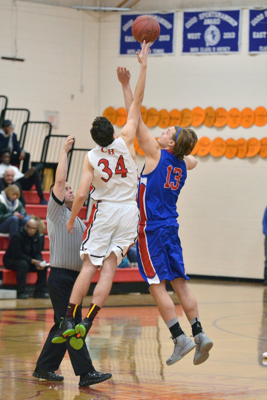 Camden Hills Morgan Ford got the jump on the opening tip. (Photo by Ron Hawkes)