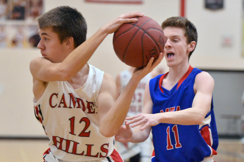 Camden’s Julian Starbird grabs a rebound and outlets it in front of Mt. Ararat’s Eric Segars. (Photo by Ron Hawkes)