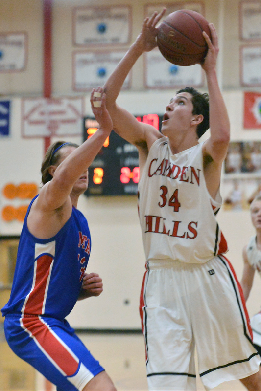 Camden’s Morgan Ford gets up over Mt. Ararat’s Alex Lafountain. (Photo by Ron Hawkes)