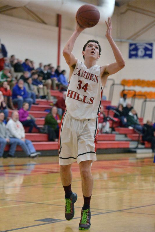 Camden Hills Morgan Ford finishes a shot. (Photo by Ron Hawkes)