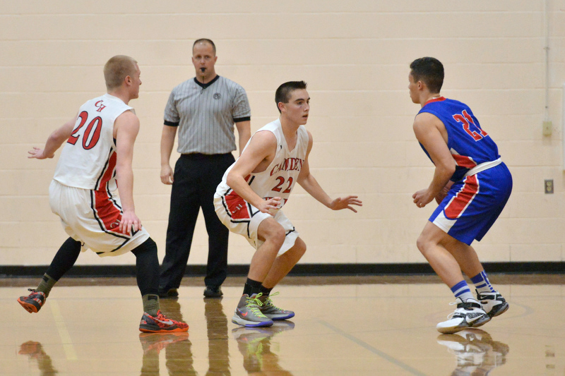Camden’s Gage Corson, left, and Noah Heidorn, center try to double team Mt. Ararat’s Shyheim Ulrickson. (Photo by Ron Hawkes)