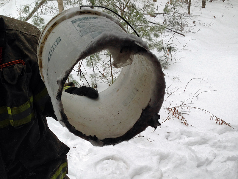Woodstove ashes, thought to be cold, were placed into this plastic bucket, which eventually melted from the heat of the smoldering embers inside it. The bucket was also located inside the cabin on Tanglewood Road in Lincolnville, where a smoldering fire between the floor boards was called in late Saturday morning. (Photo courtesy Lincolnville Fire Department)