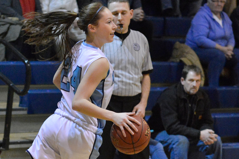 Oceanside’s Makenna Brooks clears out a rebound to set up the next shot. Oceanside beat Morse 40-37 for the win. (Photo by Ron Hawkes)