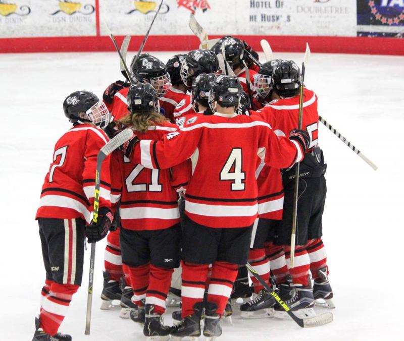 Camden Hills hockey players celebrate a 8-3 victory over Gorham after the final buzzer. (Photo Courtesy of Molly Cole)