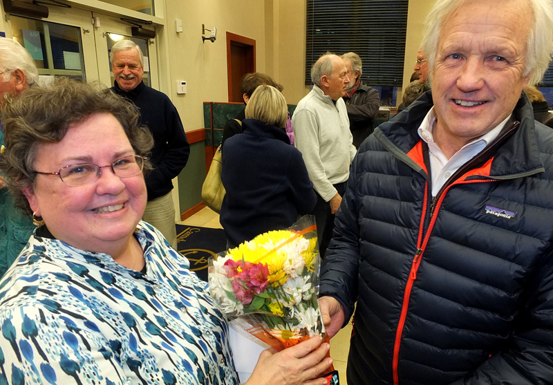 Steve and Laurie Smith present Perry with a bouquet of flowers.