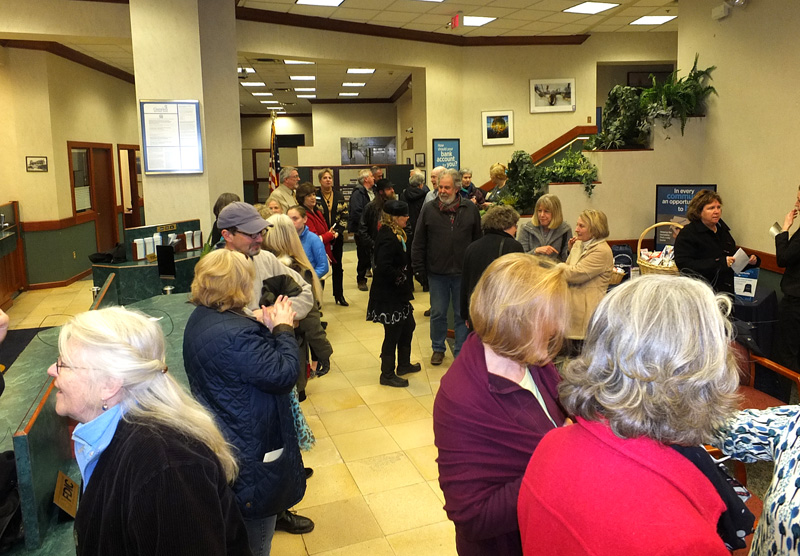 The Camden National Bank downtown bank lobby fills quickly with family, friends and well wishers.