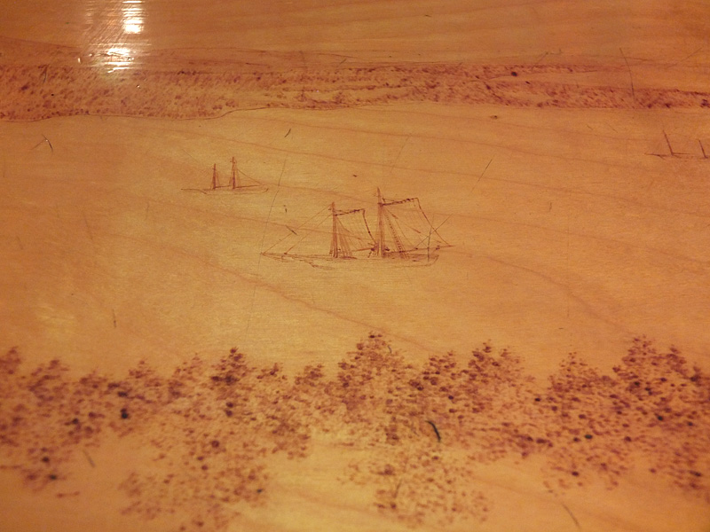 A schooner sails in one part of the bar.