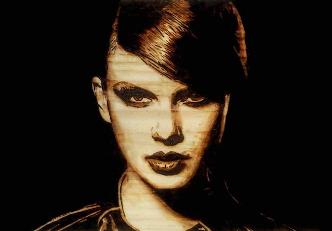 Spofford’s depiction of Taylor Swift in a woodburn the singer recently responded to via social media. (photo courtesy Zach Spofford)