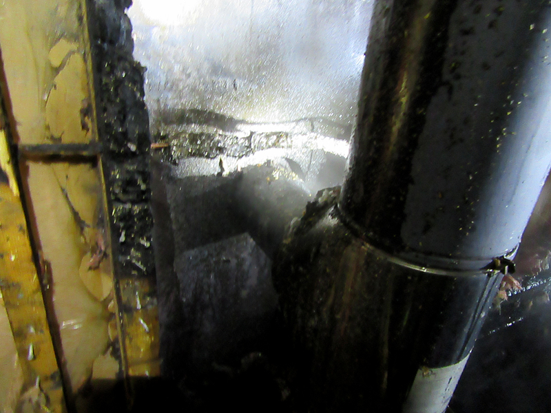 Failure to install this stove pipe with a double jacket or other protection from the wood wall it went through was blamed for igniting a fire Saturday night in Rockport. (Courtesy Rockport Fire Department)