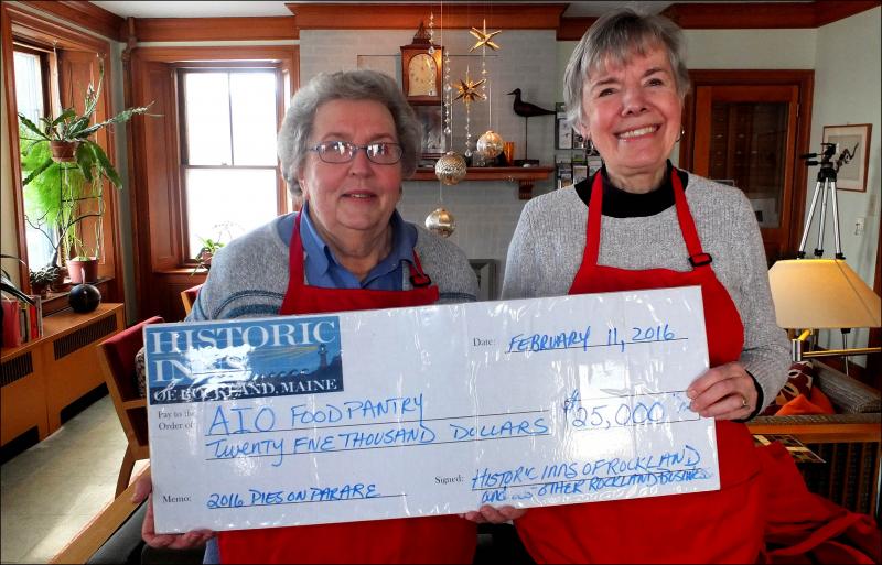 Linda Pieper and Sherry Cobb of the Interfaith AIO Food Pantry display the check for $25,000 presented to them by Pies on Parade Thursday afternoon. (Photos by Chris Wolf)