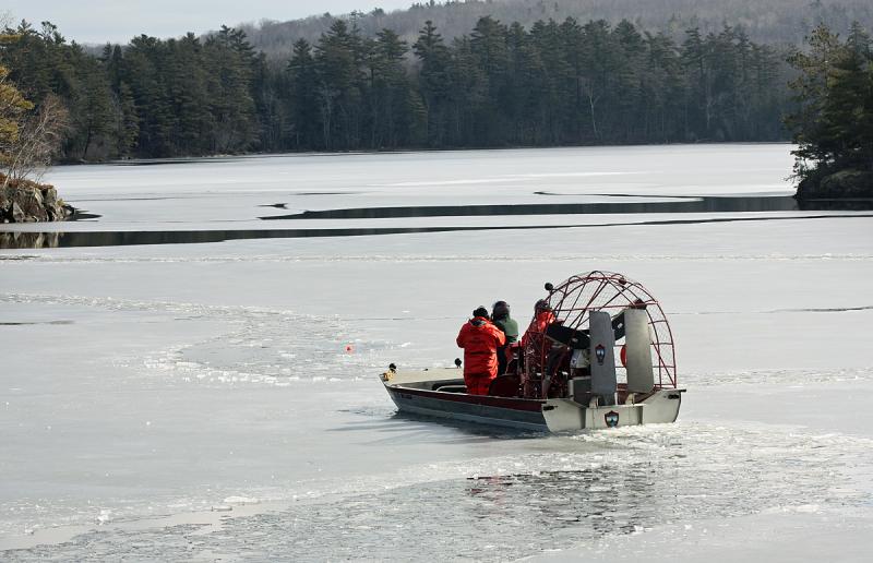 Maine Warden Service divers head toward the buoy, placed by wardens Monday night at the spot Trueman Moore was believed to have gone through the ice. (Photo by Holly S. Edwards)