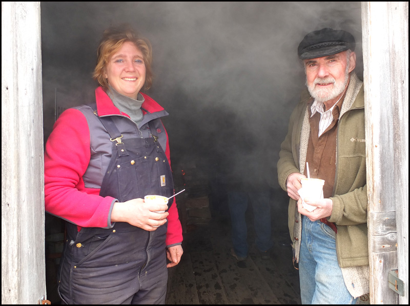 Winston Pendleton and his daughter, Wendy Harvey, without the steam as they make maple syrup at the sugar shack. (Photo by Chris Wolf)